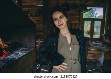 Woman In Blacksmith Shop. Interior Of An Old Forge.