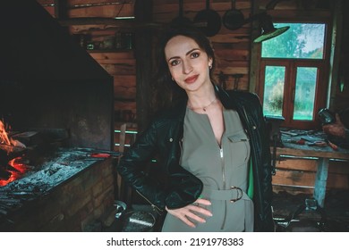 Woman In Blacksmith Shop. Interior Of An Old Forge.