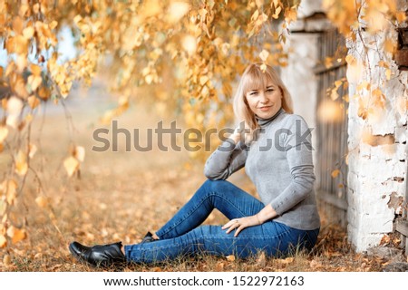 Similar – Foto Bild Herbstportrait eines glücklichen Kindes Mädchens im Garten sitzend