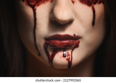 Woman With Bloody Mouth Close Up Photo