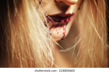 Woman With Bloody Mouth Close Up Photo