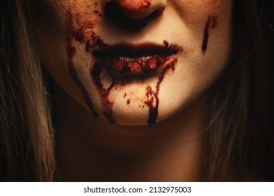 Woman With Bloody Mouth Close Up Photo