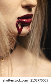 Woman With Bloody Mouth Close Up Photo