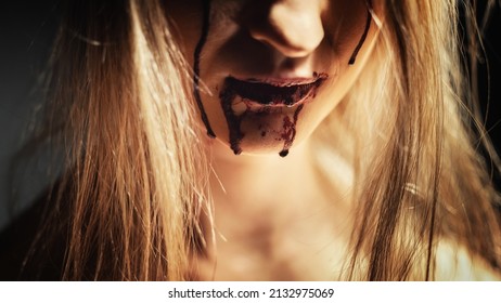 Woman With Bloody Mouth Close Up Photo