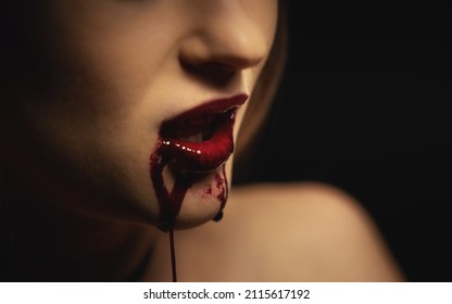 Woman With Bloody Mouth Closeup Photo