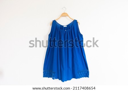  Woman blouse with blue blouse cotton on white background.