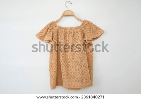 Woman blouse with summer blouse cotton on white background.