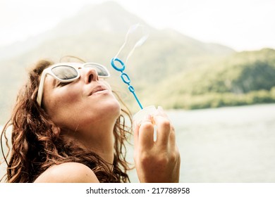 Woman Blowing Bubbles