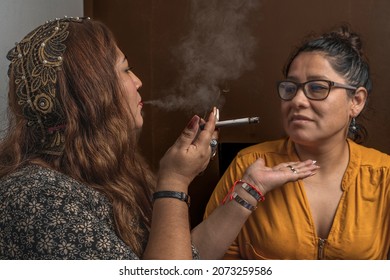 Woman Blowing Cigarette Smoke At Another Woman's Face, Ritual, Horizontal Background