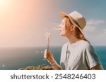 Woman Blowing Dandelion Seeds in Sunny Weather