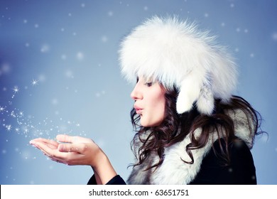 Woman Blowing Snow