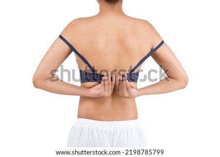 The woman in a blue bra holding her breast isolated over white background. Breast cancer awareness