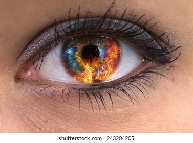woman blue eye with burning fire in it