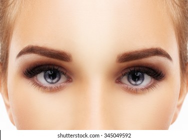 Woman blue eye with makeup and long eyelashes