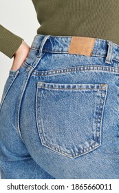 Woman In A Blue Jeans With A Tag Mockup