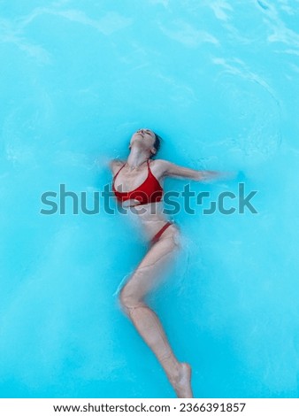 Woman in a blue lagoon in Iceland