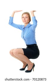 woman in blue shirt holds imaginary item over her head, isolated on white