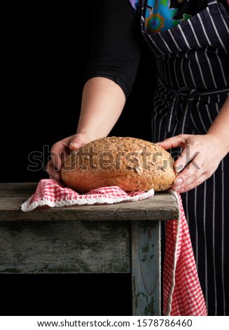 Similar – Image, Stock Photo baked round rye bread with sunflower seeds