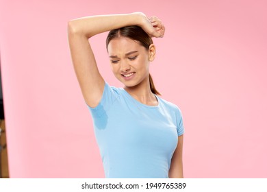 Woman In Blue T-shirt Sweaty Armpits Foul Odor