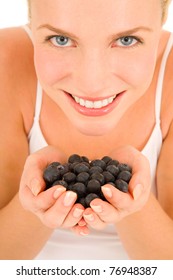 Woman With Blueberries In Hand