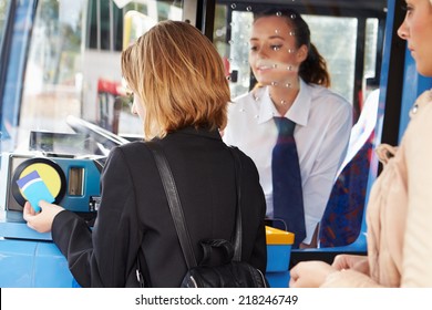 Woman Boarding Bus And Using Pass - Shutterstock ID 218246749