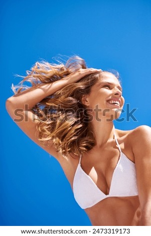 Woman, body and bikini on blue sky for holiday, vacation and summer smile or low angle outdoor. Tourist, nature and Miami for confidence, clean air and weekend beach travel with swimsuit for mock up
