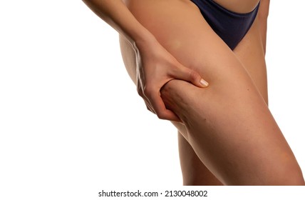 woman body care lifestyle concept of leg with wrinkled skin and cellulite on white background