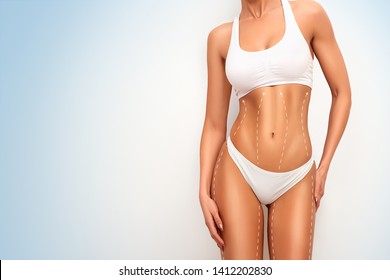 Woman body in perfect form, cosmetic cellulite treatment, plastic surgery and liposuction.