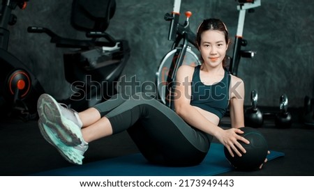 Woman bodybuilder exercising ,Beautiful young woman exercising and losing weight sports and leisure concept beautiful girl in sportswear exercise in the gym.