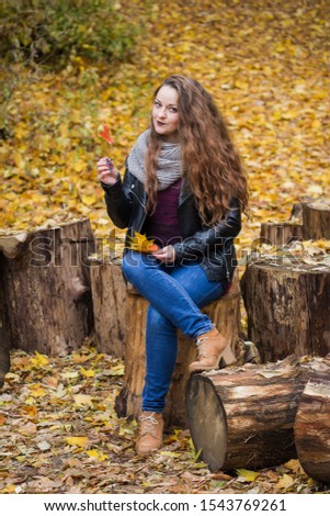 Similar – Foto Bild Herbstportrait eines glücklichen Kindes Mädchens im Garten sitzend