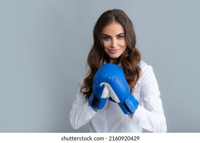 Woman in boxing gloves. Business woman with boxing gloves isolated on gary background. - Powered by Shutterstock