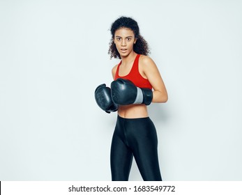 Woman In Boxing Gloves Kick Workout Motivation