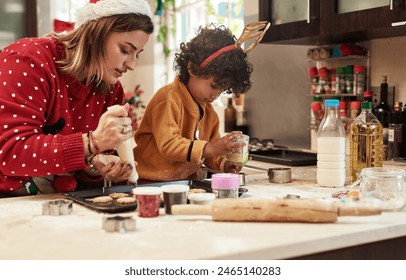 Woman, boy and baking with christmas, snack and dough learning for cookies in kitchen together. Smile, food and celebration with mother, adopted son and child in home to prepare sweet treat or love - Powered by Shutterstock