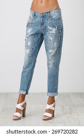 Woman In The Boyfriend Jeans And High Heel Shoes