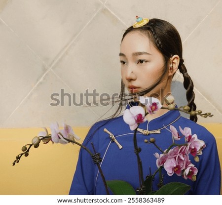 Image, Stock Photo Woman holding pink orchid