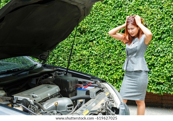 Woman with breakdown car calling roadside\
service to fix the engine failure, emergency automotive vehicle\
insurance for lady, auto support\
concept