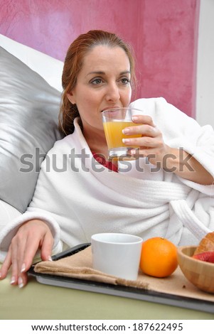 woman breakfast in her bed peacefully one day