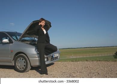 Woman Breaking Down Of Car And Discussing With Her Telephone