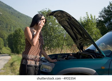 Woman Breaking Down Of Car And Discussing With Her Telephone