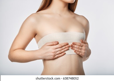 Woman breast with bandage surgery