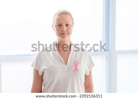 A woman with Breast cancer in a bright room