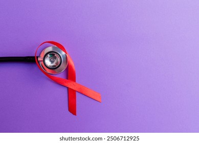 Woman breast cancer concept. Red ribbon, stethoscope on the purple background. Top view, copy space. - Powered by Shutterstock