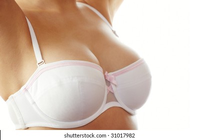 Woman Breast In Uplift On A White Background