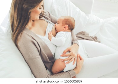 A woman is breastfeeding a baby. Breastfeeding. 