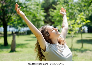 Woman Breathing Fresh Air Outdoors In Summer, Celebrating While Out In Nature