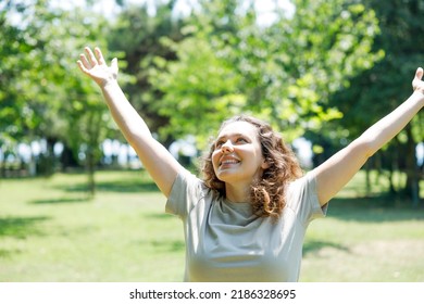 Woman Breathing Fresh Air Outdoors In Summer, Celebrating While Out In Nature