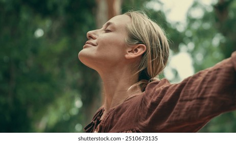 Woman breathing fresh air outdoors - Powered by Shutterstock