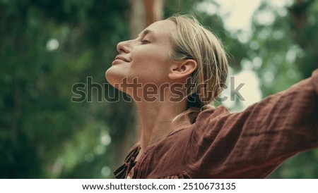 Woman breathing fresh air outdoors