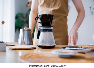 Woman Brewing Coffee In The Room