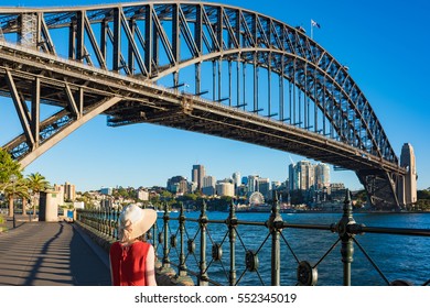 Woman In Bright Top And Hat Against Sydney Harbour Bridge On The Background. Tourist Destination Concept